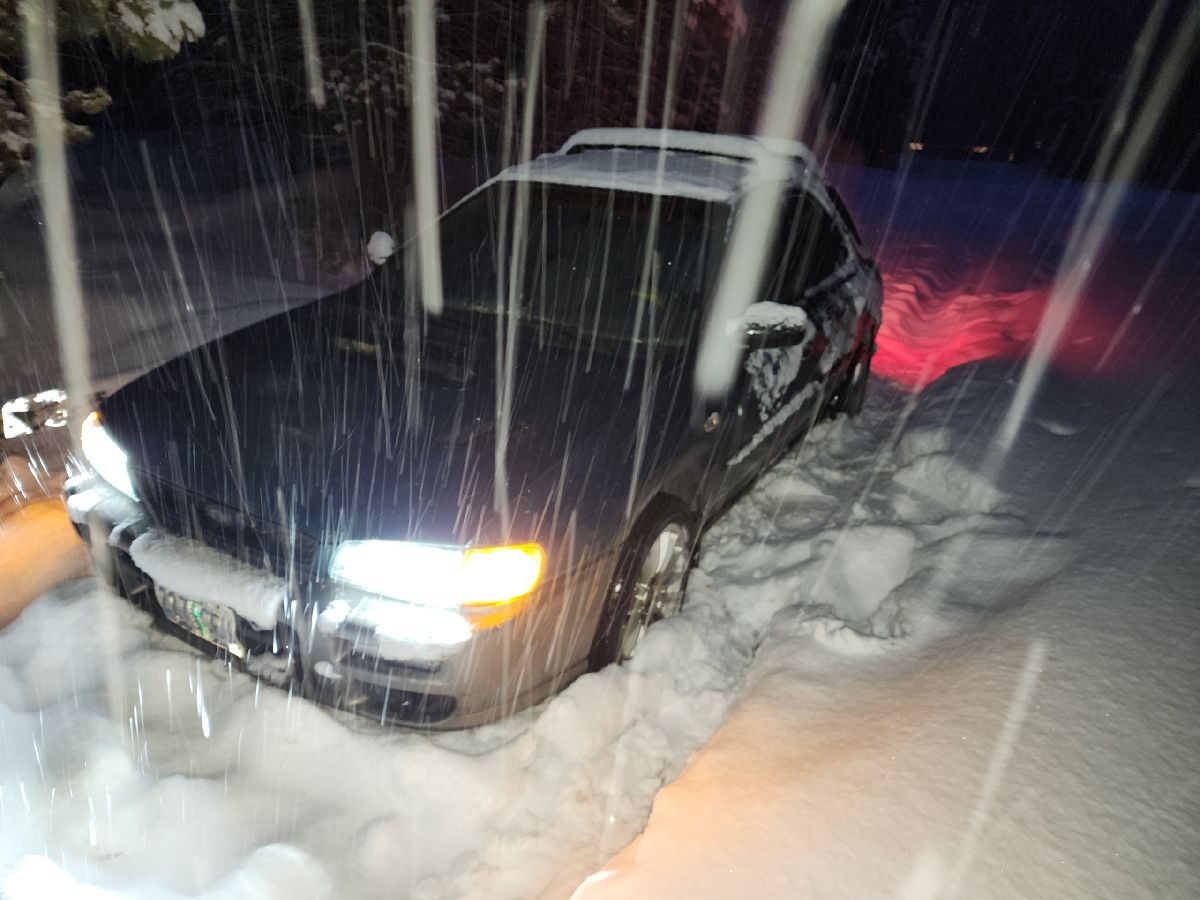 subaru impreza stuck in the snow with slick tires