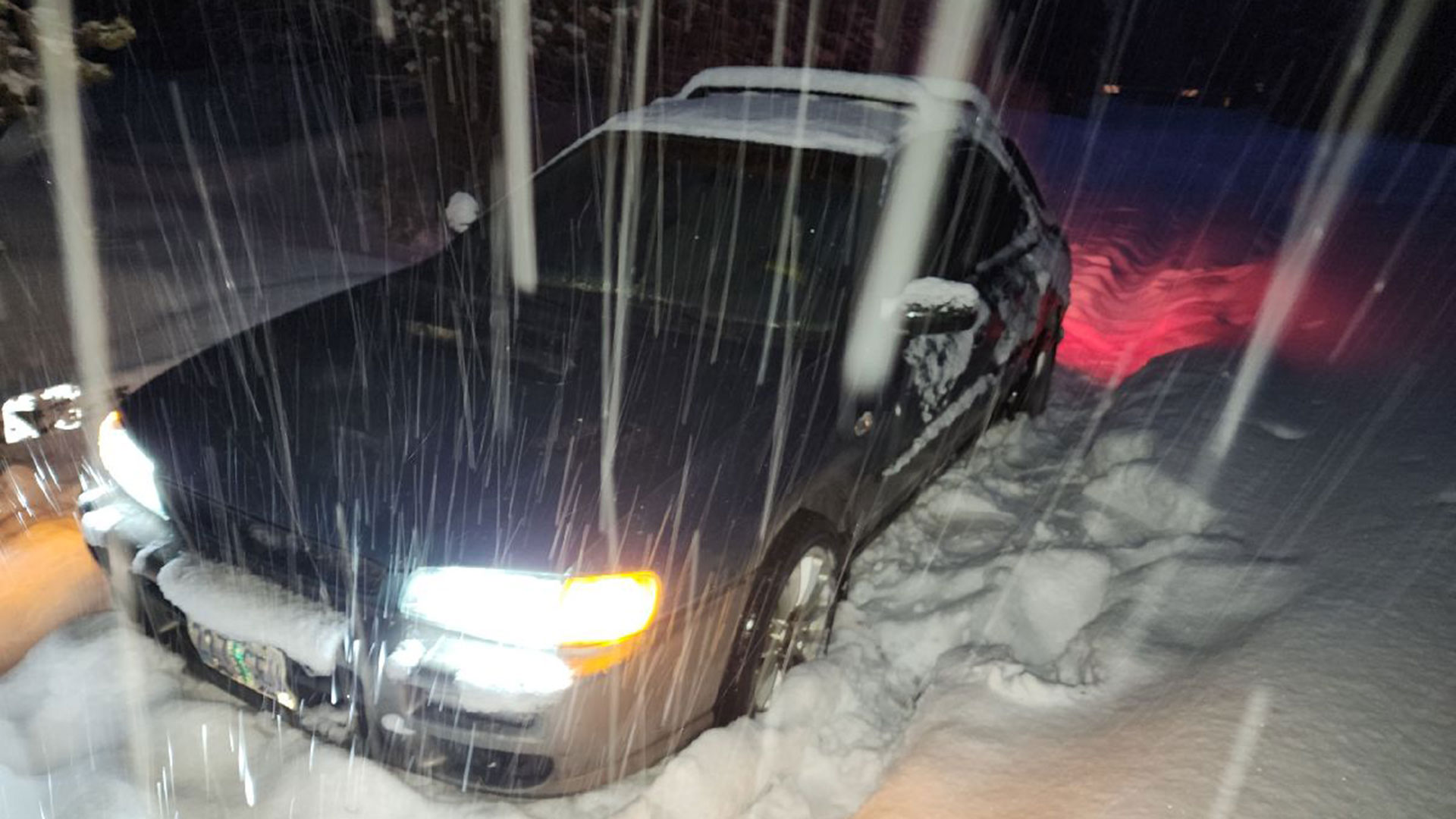 Impreza with highway slicks stuck in snow