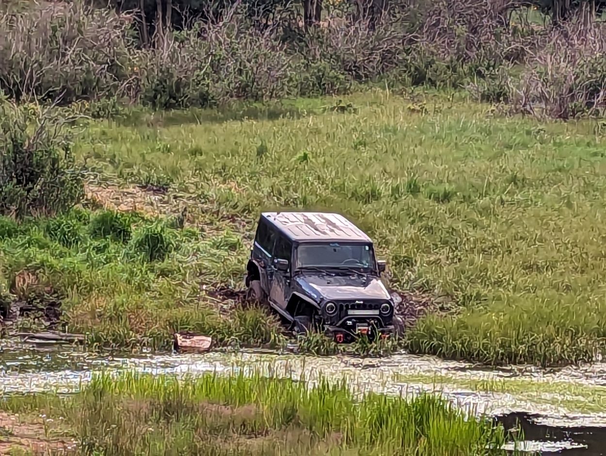 jeep in deep mud