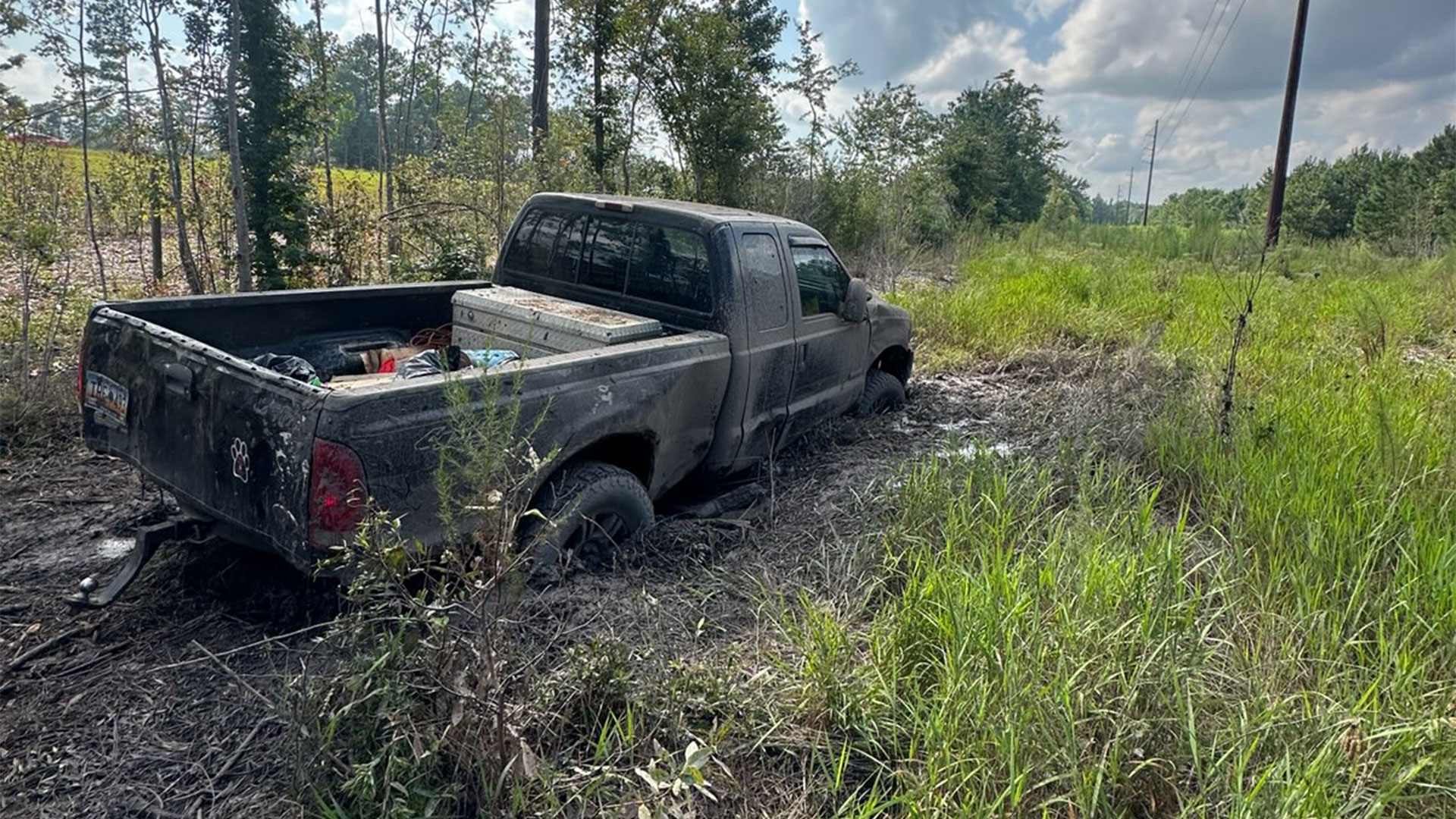 F250 stuck in deep mud