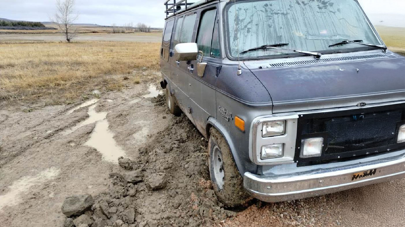 Chevy G-20 Van is stuck in mud/clay