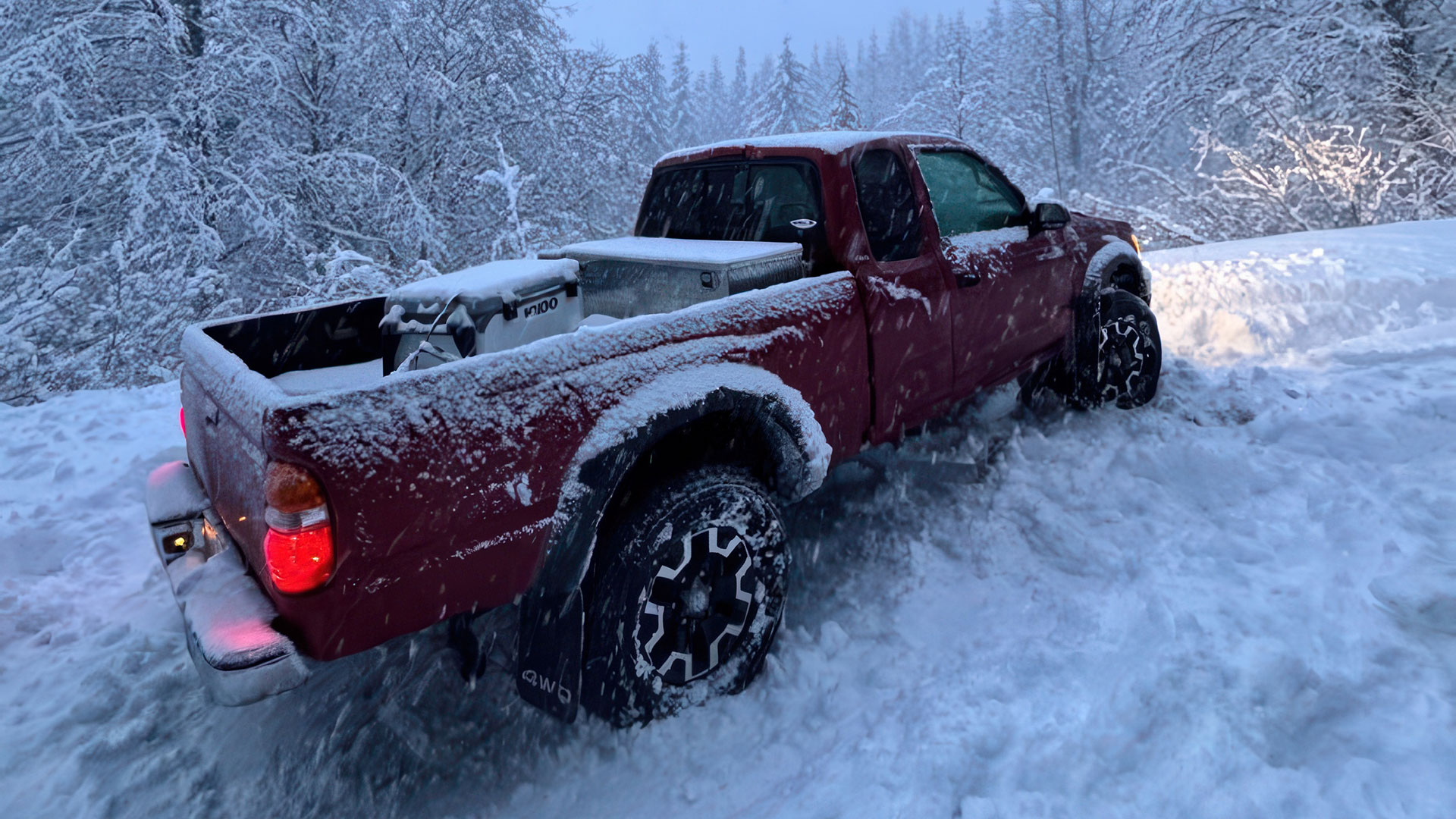 Toyota Tacomas slid off into fairly deep snow drift