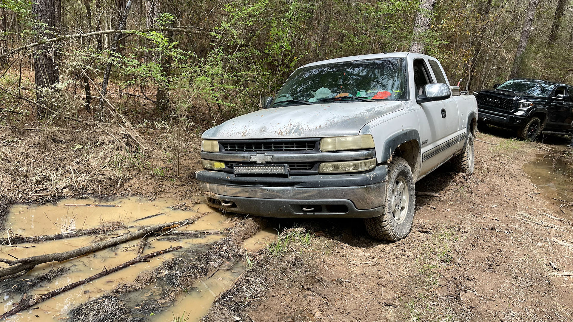 Chevy 4×4 truck stuck on mud
