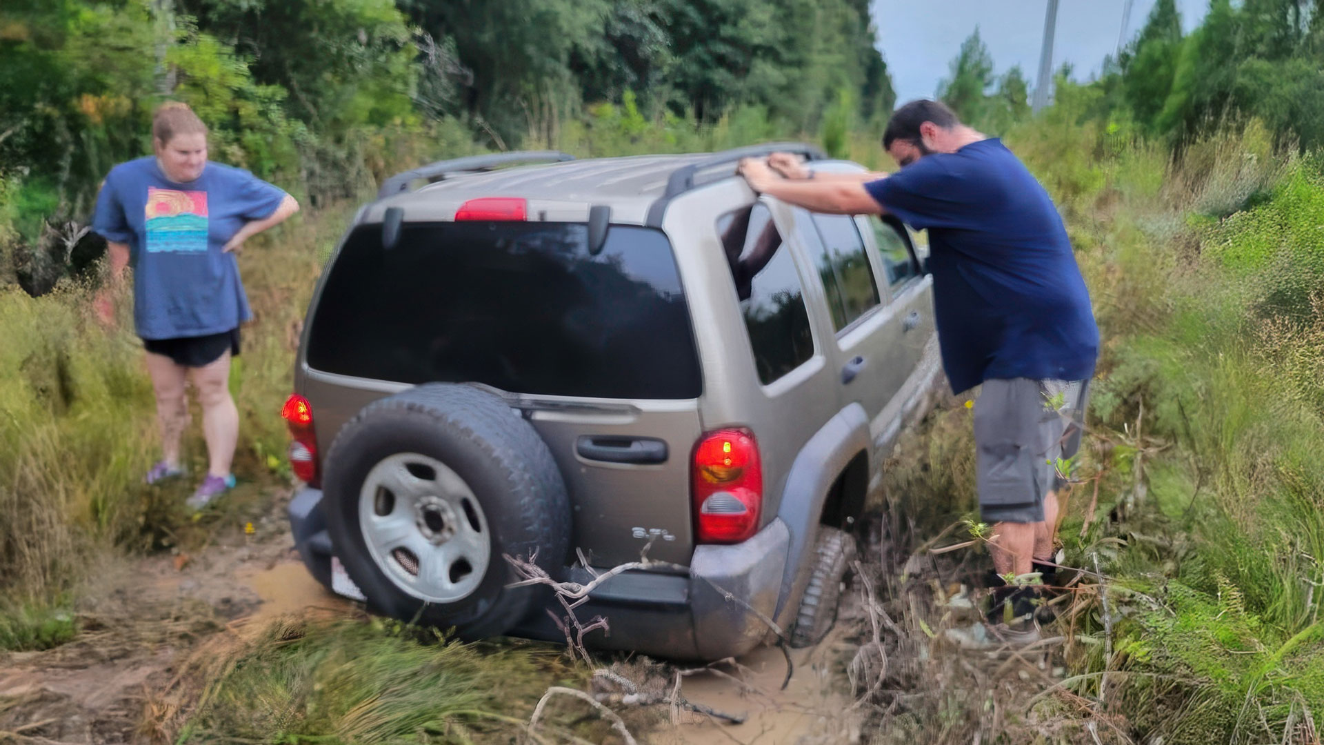 Jeep liberty stuck in power line