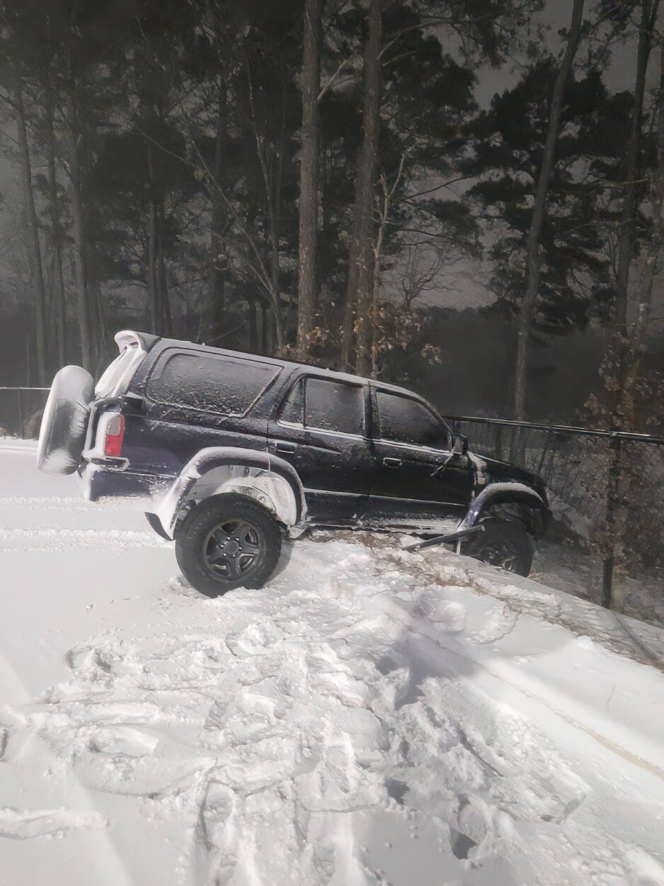 Toyota Hilux Surf 4x4 diesel is halfway off a cliff north carolina 4x4 rescue