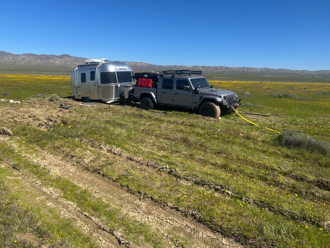 Jeep Gladiator and a small trailer stuck 